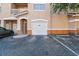 Exterior garage view, displaying the garage door, parking space, and architectural elements at 10442 Villa View Cir, Tampa, FL 33647