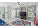Bright living room featuring a ceiling fan, and neutral walls for easy customization at 10442 Villa View Cir, Tampa, FL 33647
