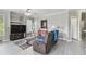 Comfortable living area with a sofa, tv, and decor at 10442 Villa View Cir, Tampa, FL 33647