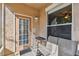 Cozy covered patio with seating area, offering a relaxing outdoor space at 10442 Villa View Cir, Tampa, FL 33647