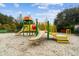 Bright and colorful community playground featuring slides, climbing structures, and benches offers recreation and fun at 10442 Villa View Cir, Tampa, FL 33647