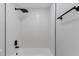 Updated bathroom showcasing a modern shower with a rain shower head and textured walls at 116 Solana St, North Port, FL 34287