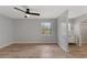 Bedroom with wood-look flooring, ceiling fan, and bathroom access with vanity at 116 Solana St, North Port, FL 34287