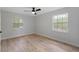 Bedroom features wood-look flooring and two windows for plenty of natural light at 116 Solana St, North Port, FL 34287