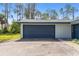 Spacious garage exterior with a dark blue door, providing functionality at 116 Solana St, North Port, FL 34287