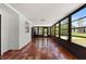 Bright sunroom with tiled floors and ample natural light from surrounding windows at 116 Solana St, North Port, FL 34287