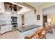 Updated kitchen with modern stainless steel appliances, white cabinetry and eat-in counter at 117 Fernwood Cir # 117, Seminole, FL 33777
