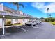 Designated covered parking area with clearly marked spaces for residents at 117 Fernwood Cir # 117, Seminole, FL 33777
