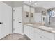 This bathroom offers a double sink vanity with modern fixtures and neutral decor at 12304 Freesia Ct, Riverview, FL 33569
