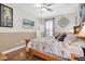 Cozy bedroom with wood floors, a large bed, and decorative accents at 12304 Freesia Ct, Riverview, FL 33569