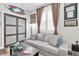 This den provides a comfortable sofa and natural light from the window at 12304 Freesia Ct, Riverview, FL 33569