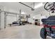 Spacious garage with ample storage, a trailer, and room for an ATV at 12304 Freesia Ct, Riverview, FL 33569