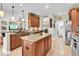 Spacious kitchen with an island, granite countertops, stainless appliances, and ample cabinet space at 12304 Freesia Ct, Riverview, FL 33569