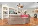 Comfortable living room with built-in shelving, hardwood floors, and an open layout, ideal for relaxation at 12304 Freesia Ct, Riverview, FL 33569