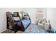 bedroom featuring fun blue bunk beds, a road rug, and a comfy couch for play and relaxation at 12402 Fairlawn Dr, Riverview, FL 33579