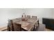 Dining room with a large wooden table, bench, and room for entertaining at 12402 Fairlawn Dr, Riverview, FL 33579