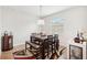 Cozy dining room with a stylish table, bench seating, and a modern chandelier at 12402 Fairlawn Dr, Riverview, FL 33579