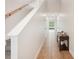 Bright hallway with tile flooring, leading to various rooms and a view of the backyard through the glass door at 12402 Fairlawn Dr, Riverview, FL 33579