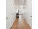 Inviting hallway with neutral walls and tiled flooring leading to the front door at 12402 Fairlawn Dr, Riverview, FL 33579