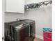Modern laundry room with high-end washer and dryer at 12402 Fairlawn Dr, Riverview, FL 33579