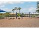 Community playground featuring swings, picnic tables, and wood chip ground cover for enjoyment at 12402 Fairlawn Dr, Riverview, FL 33579