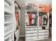 Organized walk-in closet with ample shelving, hanging space, and drawers for storage at 12402 Fairlawn Dr, Riverview, FL 33579