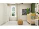 Bedroom with white walls, white accents, plants and a fan with decorative rug at 12613 Aura Moonlight Ter, Parrish, FL 34219