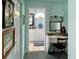Bathroom with dressing table and framed artwork in the hallway at 1345 S Evergreen Ave, Clearwater, FL 33756