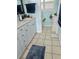 Updated bathroom featuring a large vanity with double sinks and tile floors at 1345 S Evergreen Ave, Clearwater, FL 33756