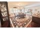 Traditional dining room with a chandelier, wooden table, and a decorative oriental-style rug at 1345 S Evergreen Ave, Clearwater, FL 33756