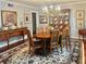 Formal dining room featuring hardwood floors, a chandelier, and elegant furnishings perfect for entertaining guests at 1345 S Evergreen Ave, Clearwater, FL 33756