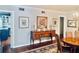 Elegant dining room with hardwood floors, a sideboard and an open entrance to the kitchen for easy serving at 1345 S Evergreen Ave, Clearwater, FL 33756