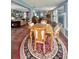 Open dining room space leading into a comfortable living area and kitchen at 1345 S Evergreen Ave, Clearwater, FL 33756