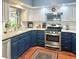 Updated kitchen features two-tone cabinets, stainless steel appliances, and modern finishes at 1345 S Evergreen Ave, Clearwater, FL 33756