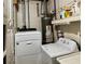 Functional laundry room features a washer, dryer, and water heater for convenient home maintenance at 1345 S Evergreen Ave, Clearwater, FL 33756