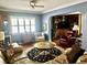 This open living area shows neutral colors, seating arrangements, and built in shelving and storage at 1345 S Evergreen Ave, Clearwater, FL 33756