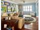 Cozy living room features a comfortable seating area and stylish decor, with beautiful wood floors at 1345 S Evergreen Ave, Clearwater, FL 33756