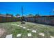 Spacious backyard featuring a fire pit, stone border and a wooden fence for privacy at 13970 Montego Dr, Seminole, FL 33776