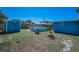 Large backyard featuring a pool and two sheds at 13970 Montego Dr, Seminole, FL 33776