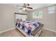 This bedroom features decorative windows and a platform bed with storage drawers at 13970 Montego Dr, Seminole, FL 33776