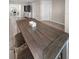 Close up of the dining table with stylish stools in a well lit space at 13970 Montego Dr, Seminole, FL 33776