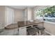 Dining area with a breakfast table, bar stools, and plenty of natural light at 13970 Montego Dr, Seminole, FL 33776
