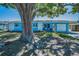 Single-story home with a well-maintained lawn, driveway, and a lovely patio area at 13970 Montego Dr, Seminole, FL 33776