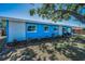 Single-story home featuring a well-maintained lawn, landscaped beds, and a vibrant exterior at 13970 Montego Dr, Seminole, FL 33776