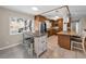 Modern kitchen with stainless steel appliances, granite countertops, and bar seating at 13970 Montego Dr, Seminole, FL 33776
