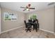 This office features tile floors and a desk with a computer and office chair at 13970 Montego Dr, Seminole, FL 33776
