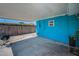 Blue patio featuring a ceiling and grill, leading to the backyard's amenities at 13970 Montego Dr, Seminole, FL 33776