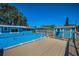 Beautiful backyard with above-ground pool, wooden deck and shed at 13970 Montego Dr, Seminole, FL 33776