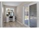 Bright room featuring a vanity with drawers and a glass sliding door to the outside at 13970 Montego Dr, Seminole, FL 33776