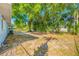 Backyard with mature trees, offering privacy and shade, perfect for relaxation at 1431 Kings Hwy, Clearwater, FL 33755